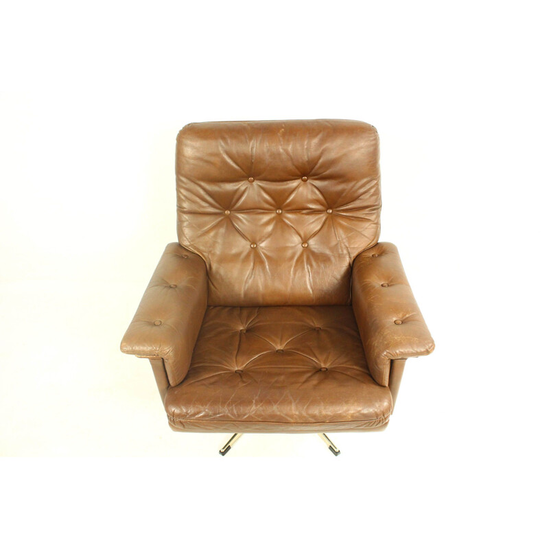 Vintage leather swivel armchair with ottoman,1970