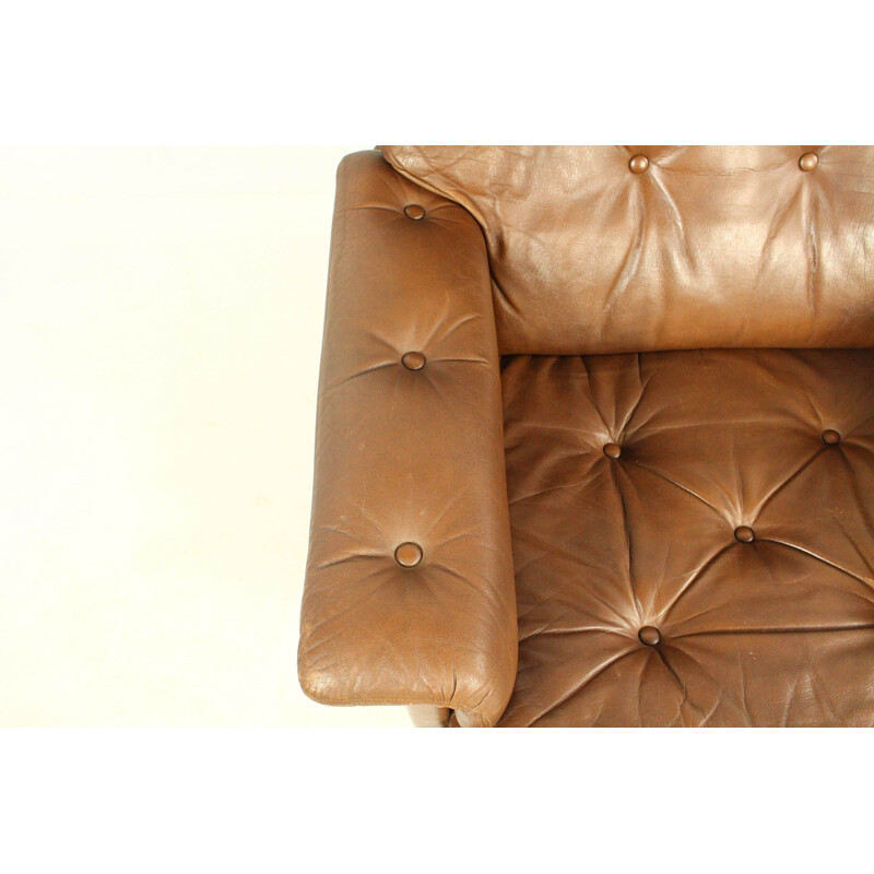 Vintage leather swivel armchair with ottoman,1970