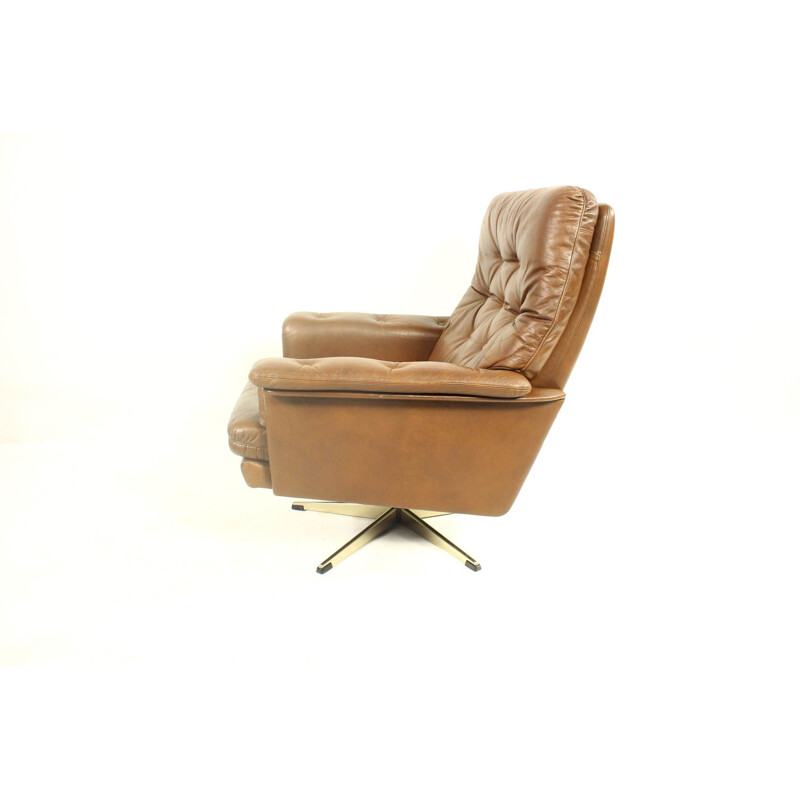 Vintage leather swivel armchair with ottoman,1970