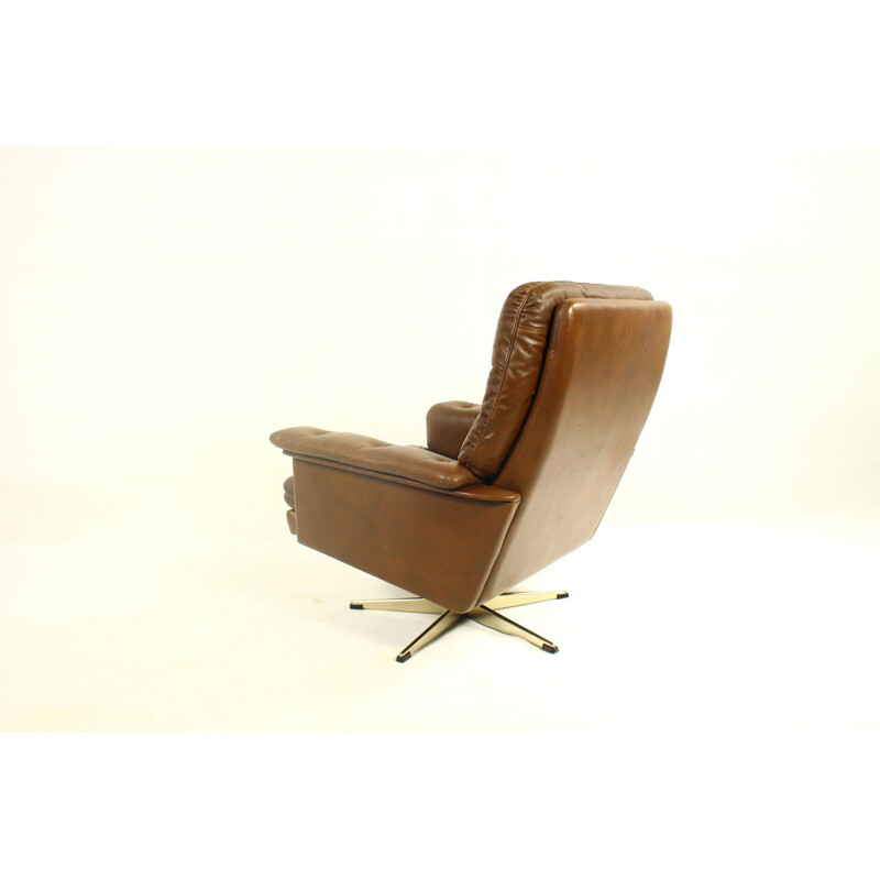 Vintage leather swivel armchair with ottoman,1970