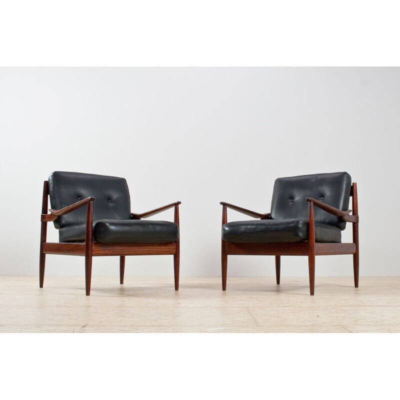 Pair of rosewood and black leatherette armchairs by Grete Jalk