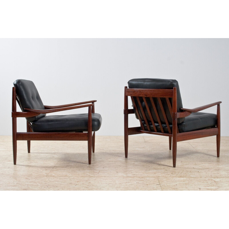 Pair of rosewood and black leatherette armchairs by Grete Jalk