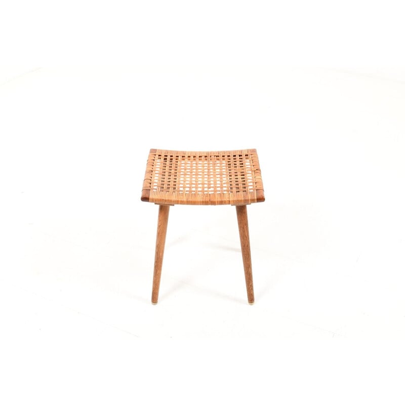 Vintage Danish footstool in oak and rattan