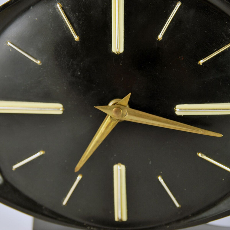 Horloge vintage en bakélite et en laiton 1950