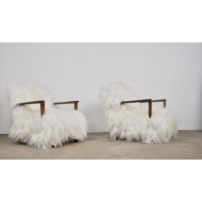 Pair of vintage armchairs in sheepskin and wood 1960
