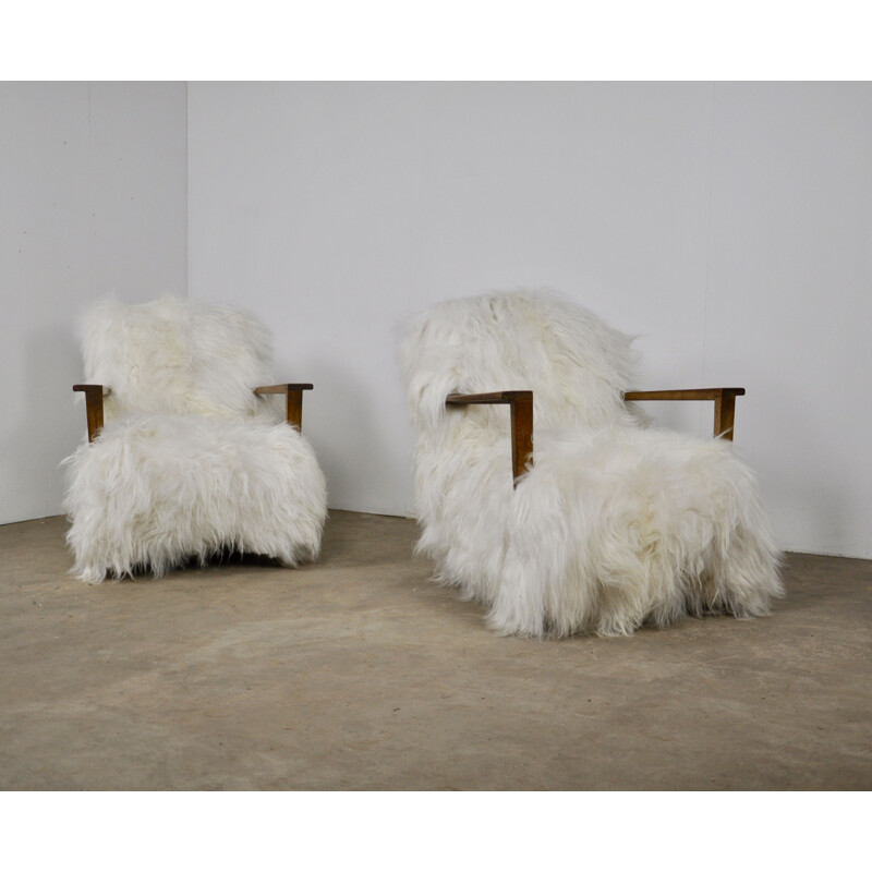 Pair of vintage armchairs in sheepskin and wood 1960