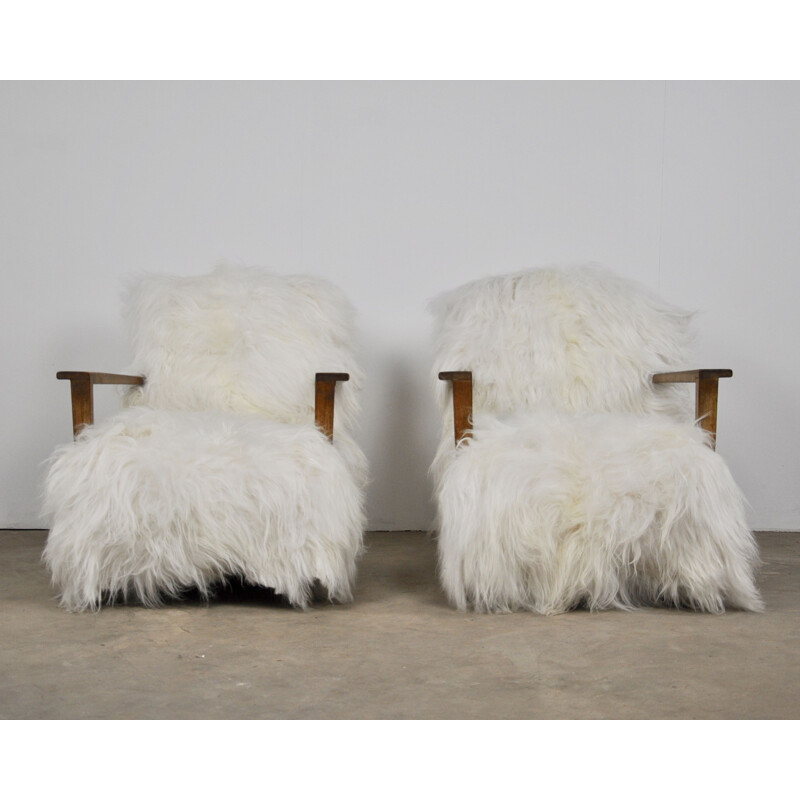 Pair of vintage armchairs in sheepskin and wood 1960