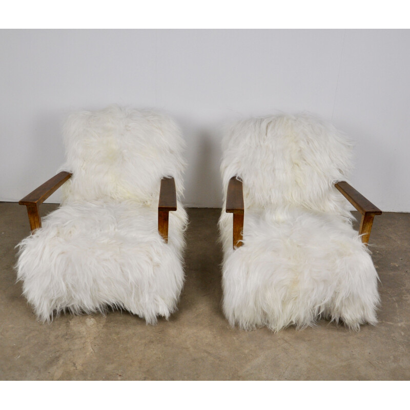 Pair of vintage armchairs in sheepskin and wood 1960