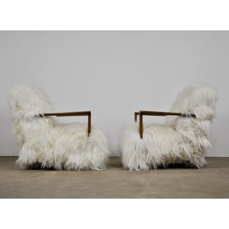 Pair of vintage armchairs in sheepskin and wood 1960