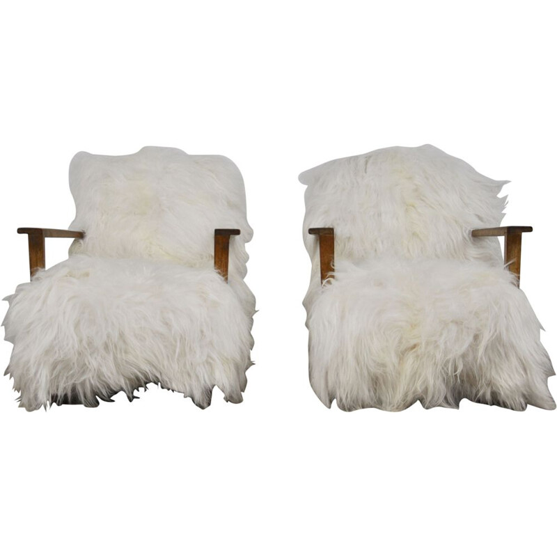 Pair of vintage armchairs in sheepskin and wood 1960