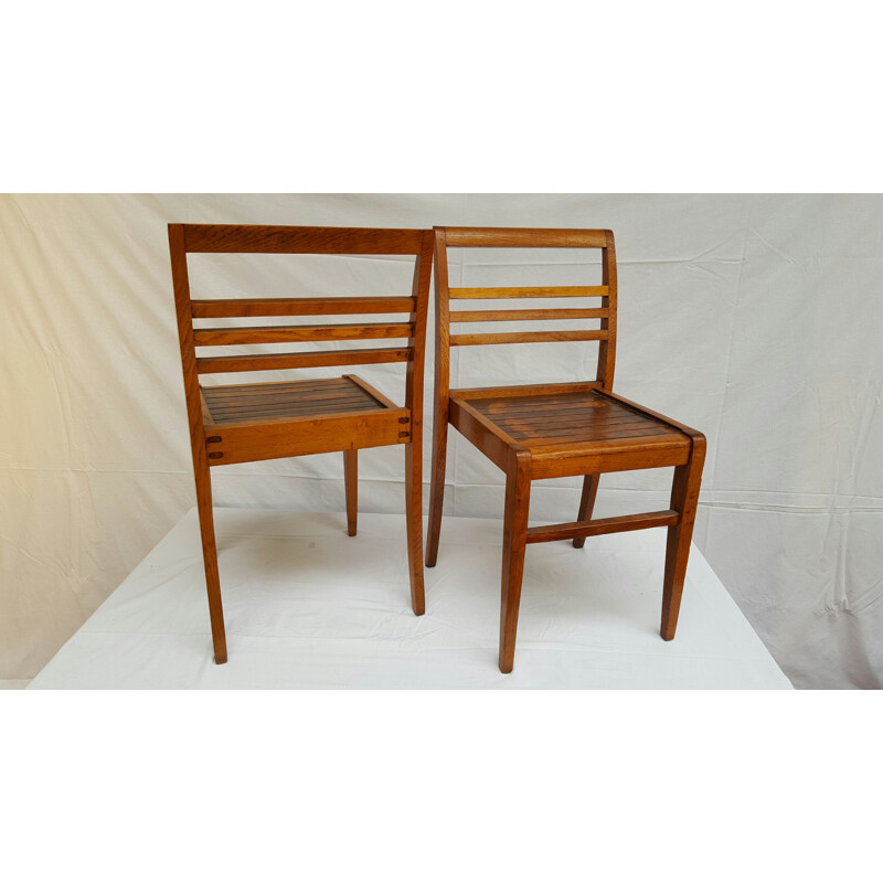 Pair of oakwood dining chairs, René GABRIEL - 1940s