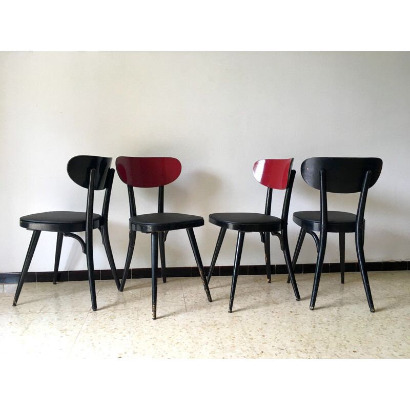 Suite de 4 chaises vintage Baumann en skaï noir et bois 1950