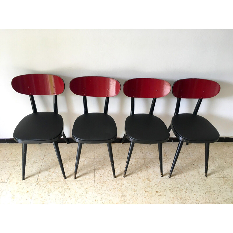 Suite de 4 chaises vintage Baumann en skaï noir et bois 1950