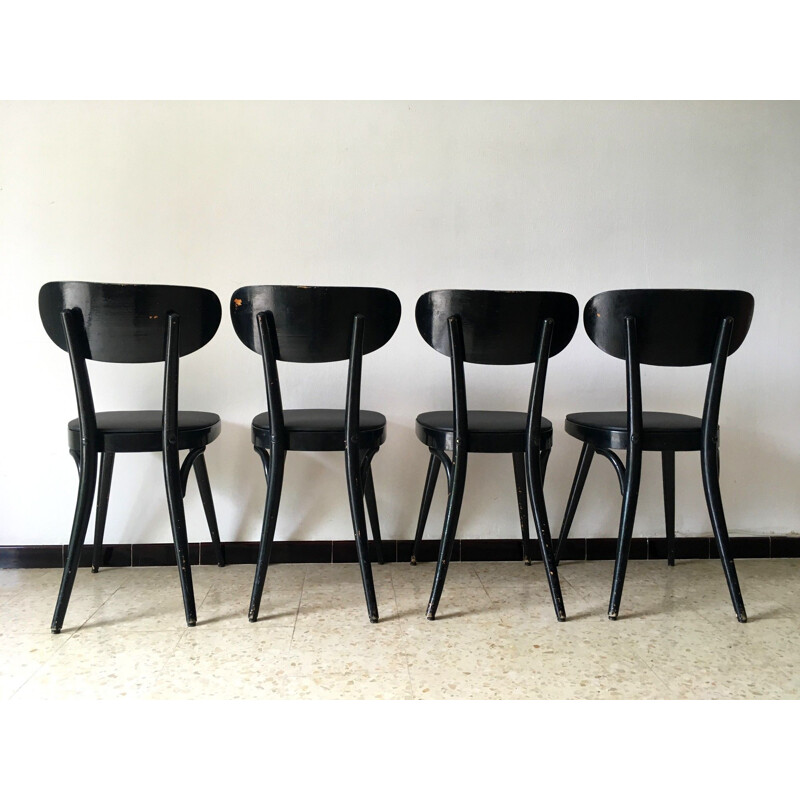 Set of 4 vintage Baumann chairs in black leatherette and wood 1950