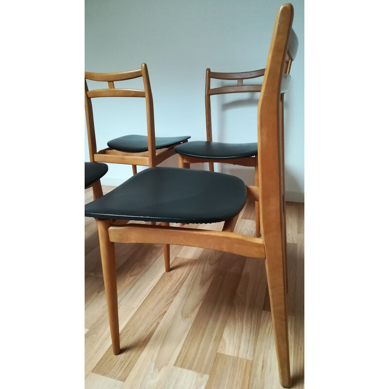 Suite de 4 chaises vintage en bois massif et simili cuir noir 1960