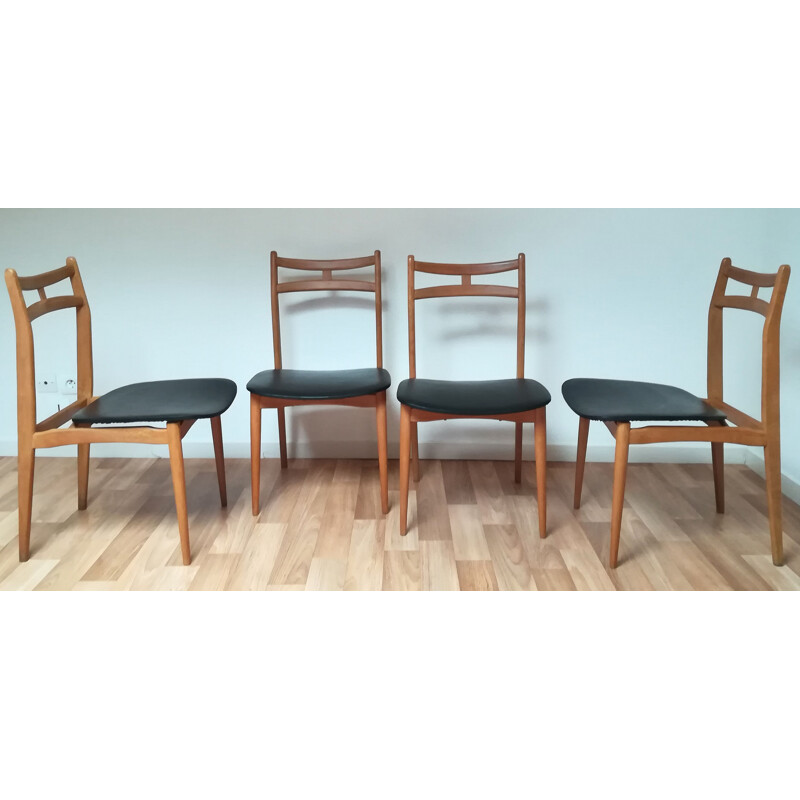 Suite de 4 chaises vintage en bois massif et simili cuir noir 1960