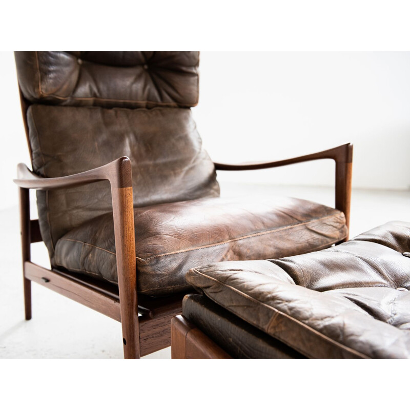 Vintage armchair and ottoman in teak and leather by Ib Kofod Larsen 1960