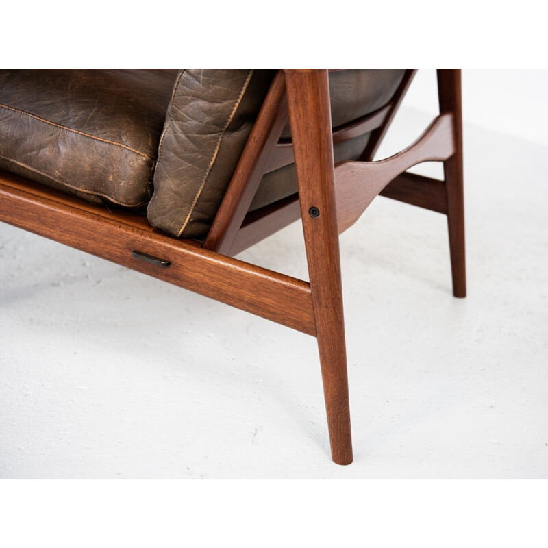 Vintage armchair and ottoman in teak and leather by Ib Kofod Larsen 1960