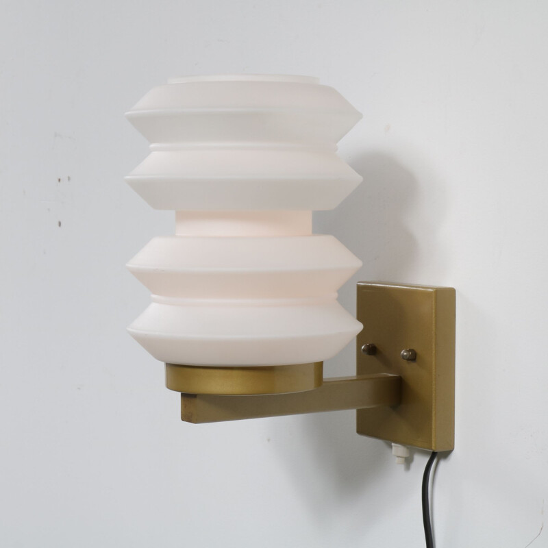 Vintage sculptural Dutch wall lamp by Raak