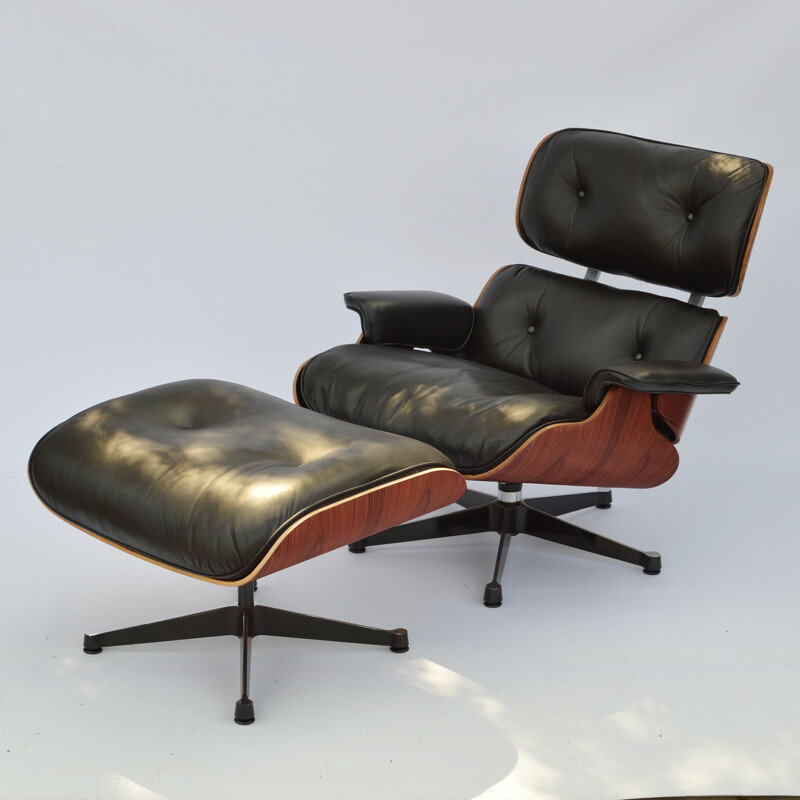 Vintage lounge chair & ottoman in rosewood Eames for Herman Miller 1964