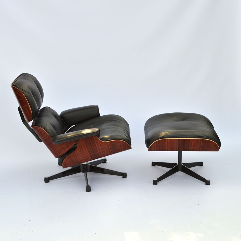 Vintage lounge chair & ottoman in rosewood Eames for Herman Miller 1964