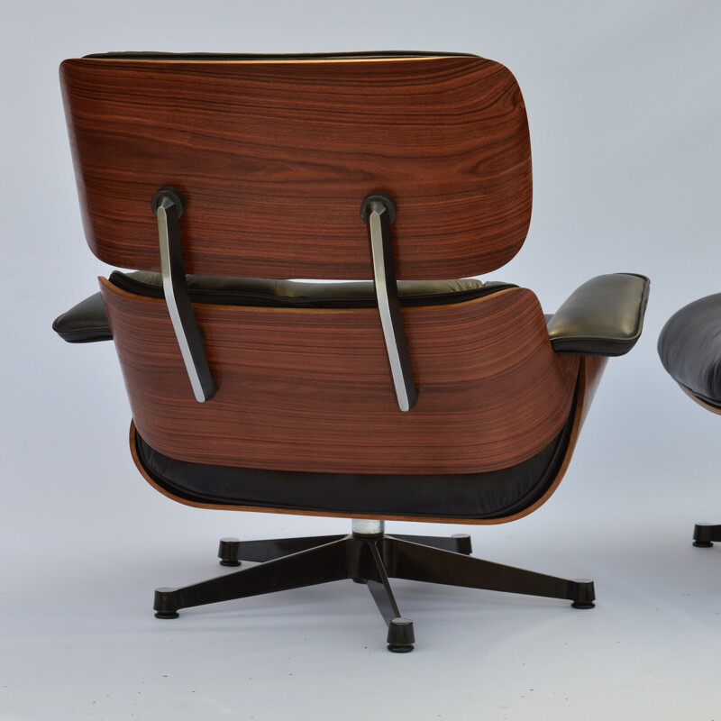 Vintage lounge chair & ottoman in rosewood Eames for Herman Miller 1964