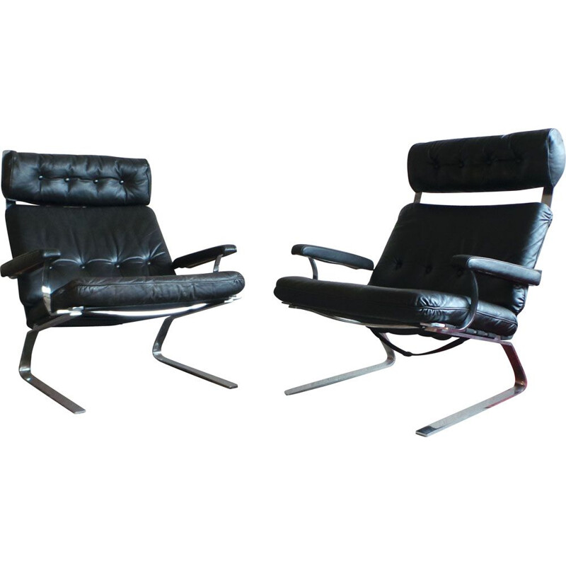Pair of black leather and steel lounge chairs