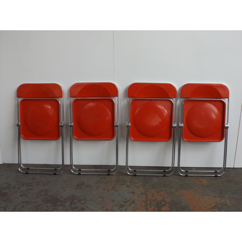 Set of 4 red Plia chairs by Giancarlo Piretti