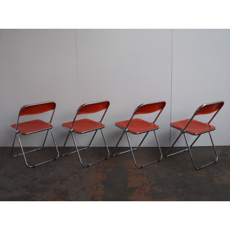 Set of 4 red Plia chairs by Giancarlo Piretti