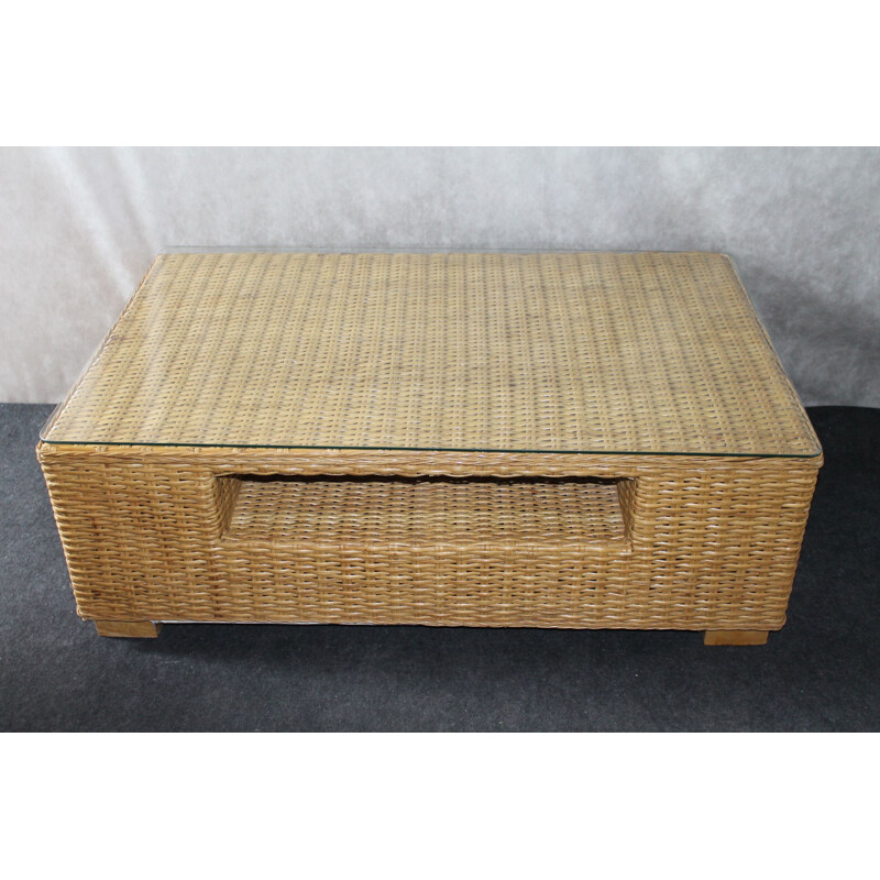 Vintage coffee table made of glass and rattan