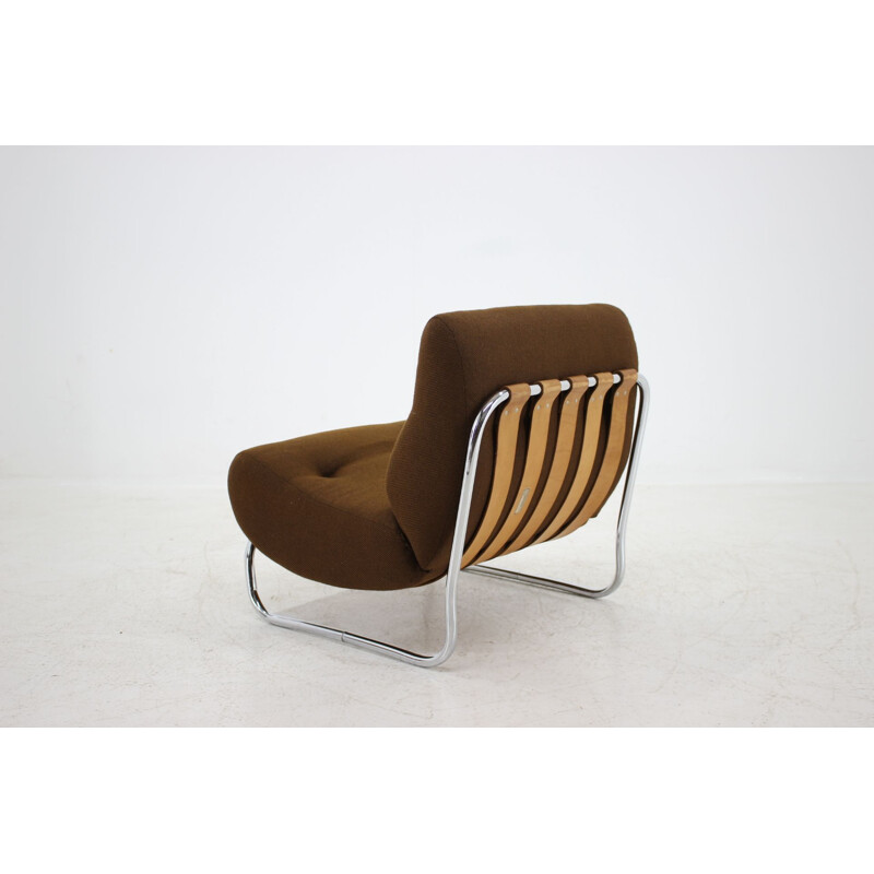 German vintage lounge chair in steel and brown fabric