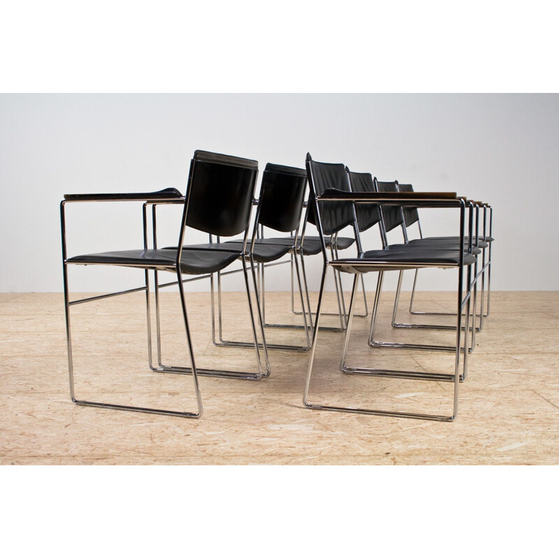 Set of 8 vintage armchairs in black leather and chromed steel, Italy 1960s