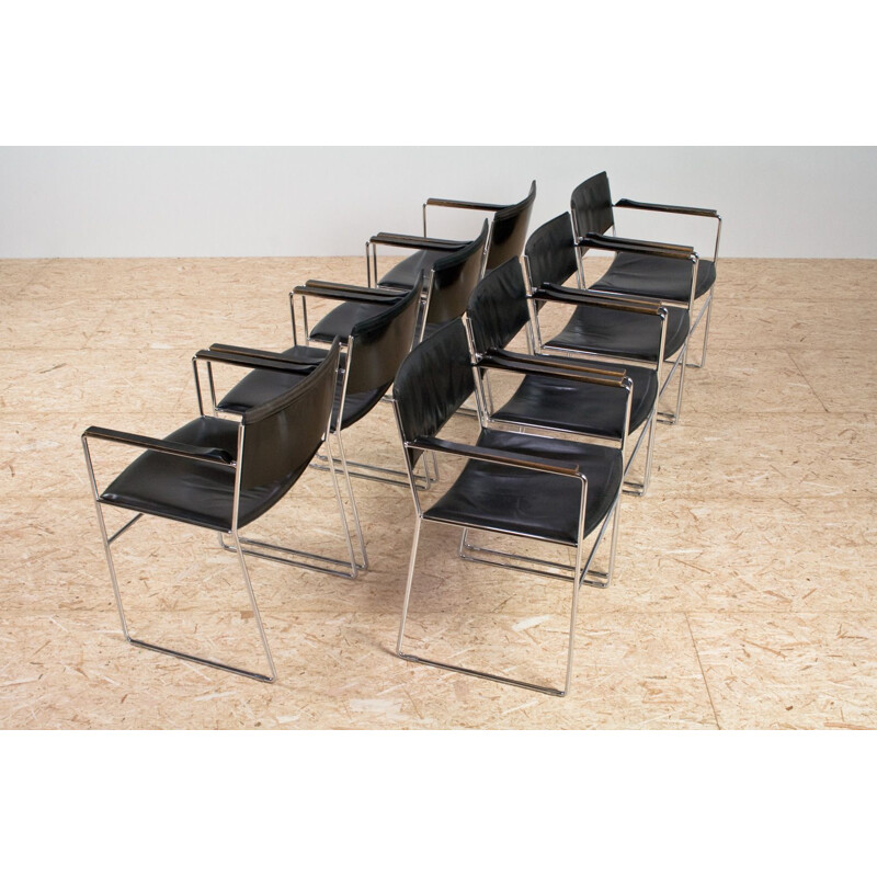 Set of 8 vintage armchairs in black leather and chromed steel, Italy 1960s