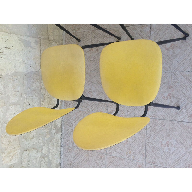 Ensemble de 4 chaises vintage skaï et métal jaunes et noires 1960