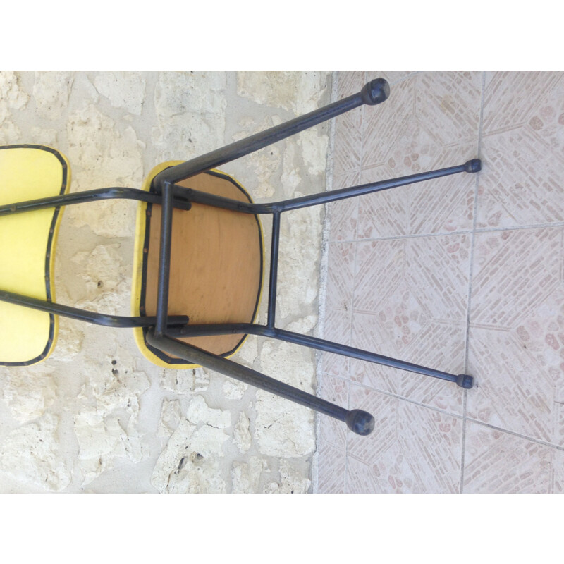 Ensemble de 4 chaises vintage skaï et métal jaunes et noires 1960