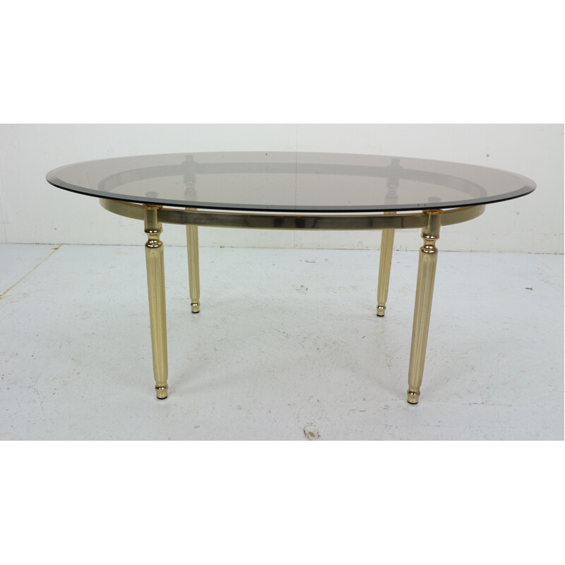 Vintage Hollywood Regency Smoked Glass and Brass Oval coffee Table 1970s