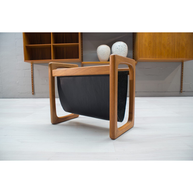 Vintage scandinavian magazine rack in teak and black leather 1970s