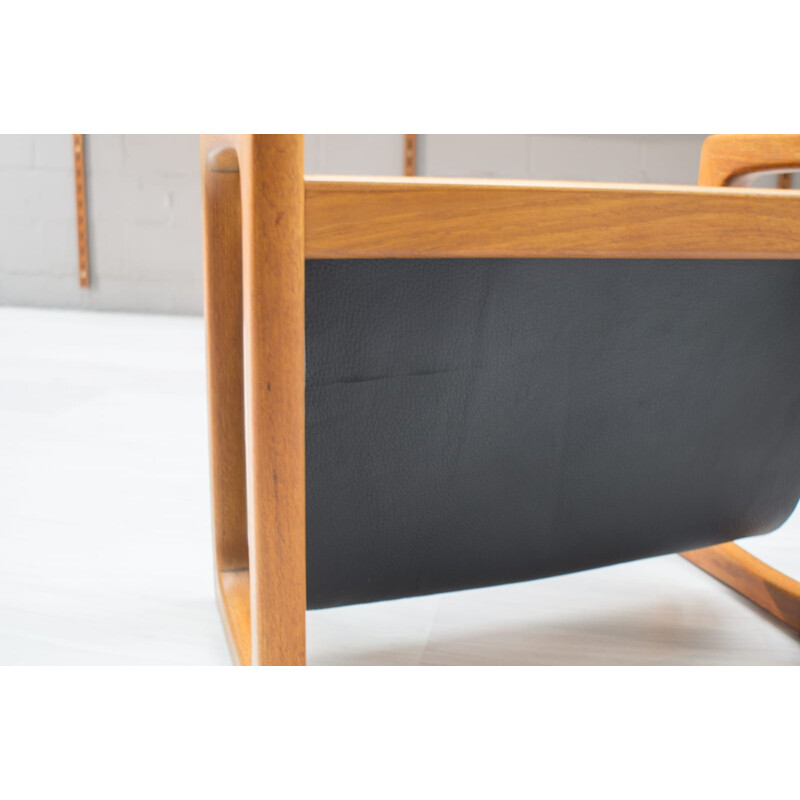 Vintage scandinavian magazine rack in teak and black leather 1970s