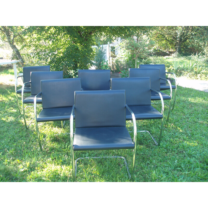 Set of 8 vintage armchairs in black leather and chrome 1970