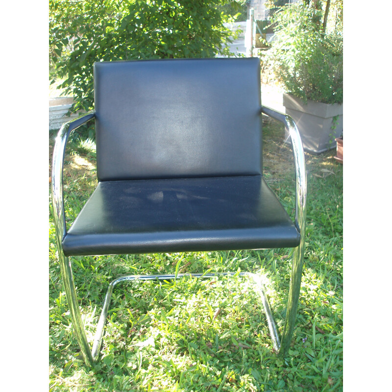 Set of 8 vintage armchairs in black leather and chrome 1970