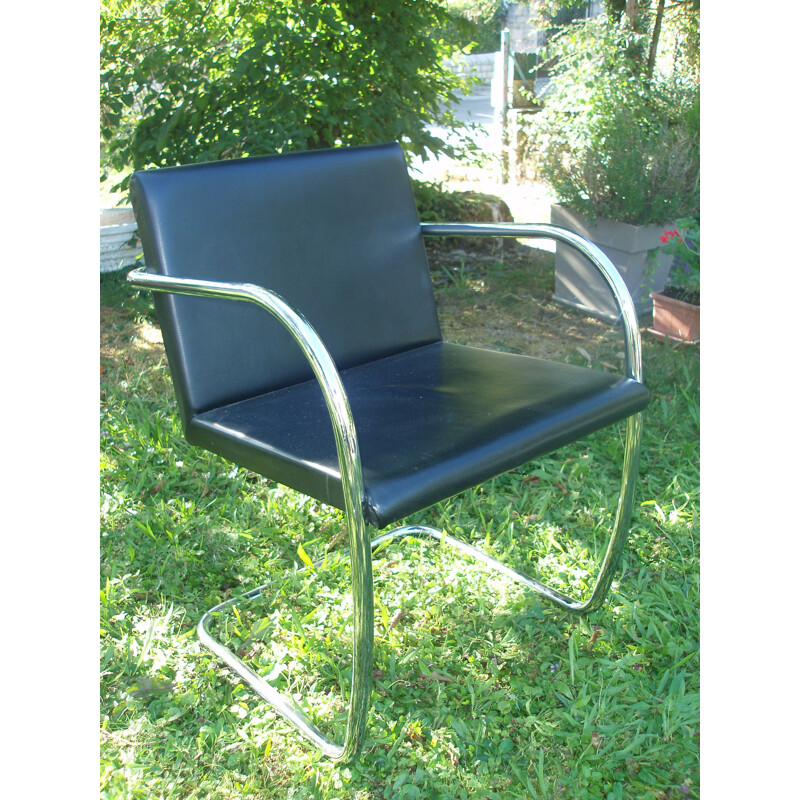 Set of 8 vintage armchairs in black leather and chrome 1970