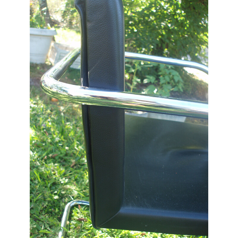 Set of 8 vintage armchairs in black leather and chrome 1970