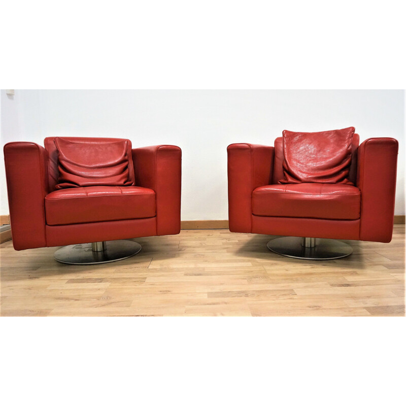 Pair of vintage red leather armchairs