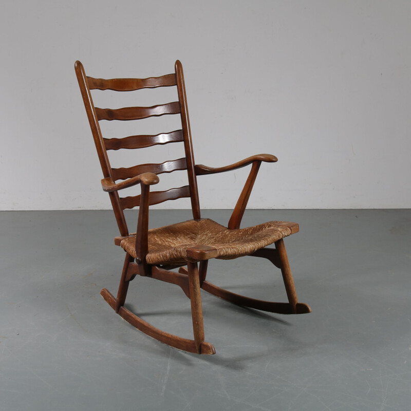 Vintage rocking chair in wood by De Ster Gelderland, Netherlands 1950s