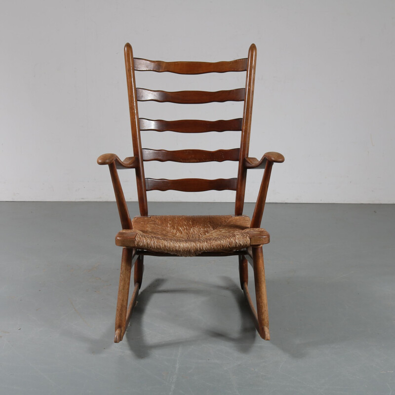 Vintage rocking chair in wood by De Ster Gelderland, Netherlands 1950s