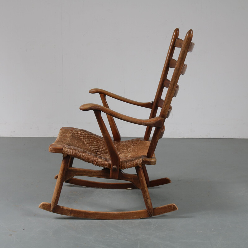 Vintage rocking chair in wood by De Ster Gelderland, Netherlands 1950s