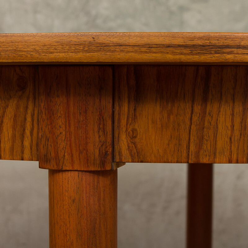 Round extendable dining table by Kai Kristiansen