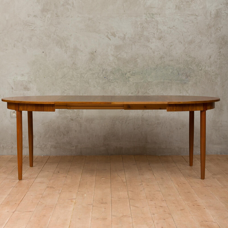 Round extendable dining table by Kai Kristiansen