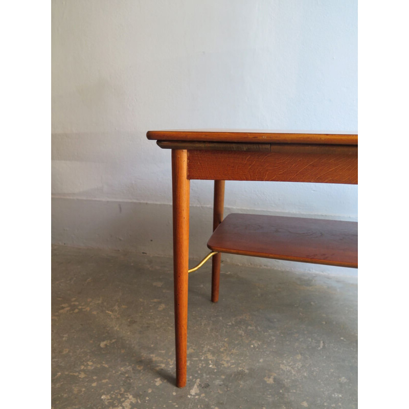 Vintage coffee table extendable in teak with lower shelf 1950s