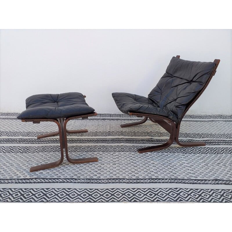 Siesta chair and ottoman in black leather by Ingmar Relling